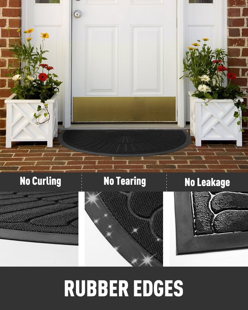 Black semicircular doormat outside a front door on a brick porch positioned between two white planter boxes