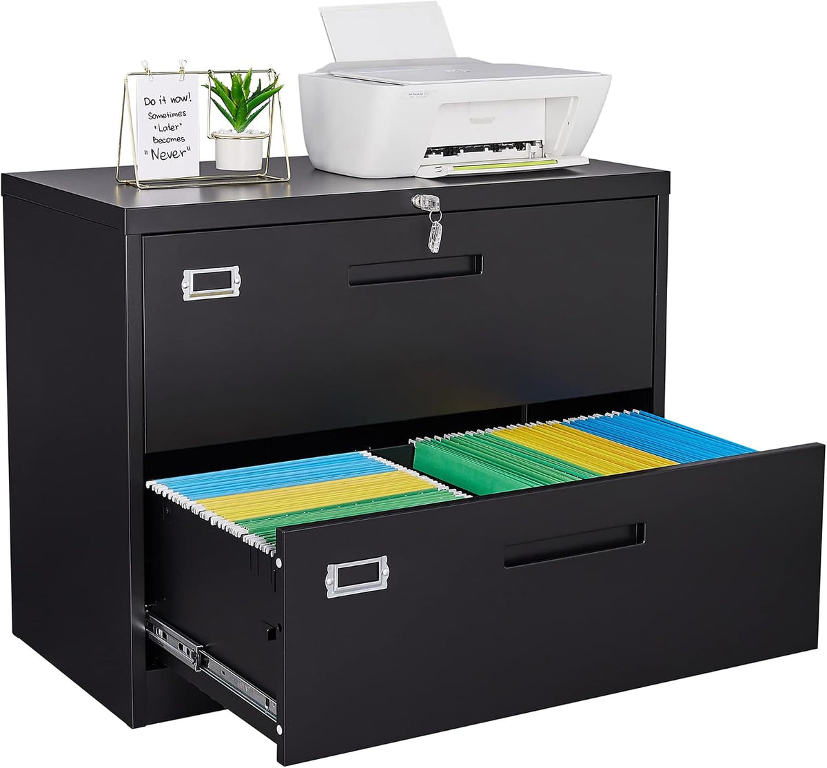 Black lateral filing cabinet with top items and the lower drawer open showing colorful hanging files.