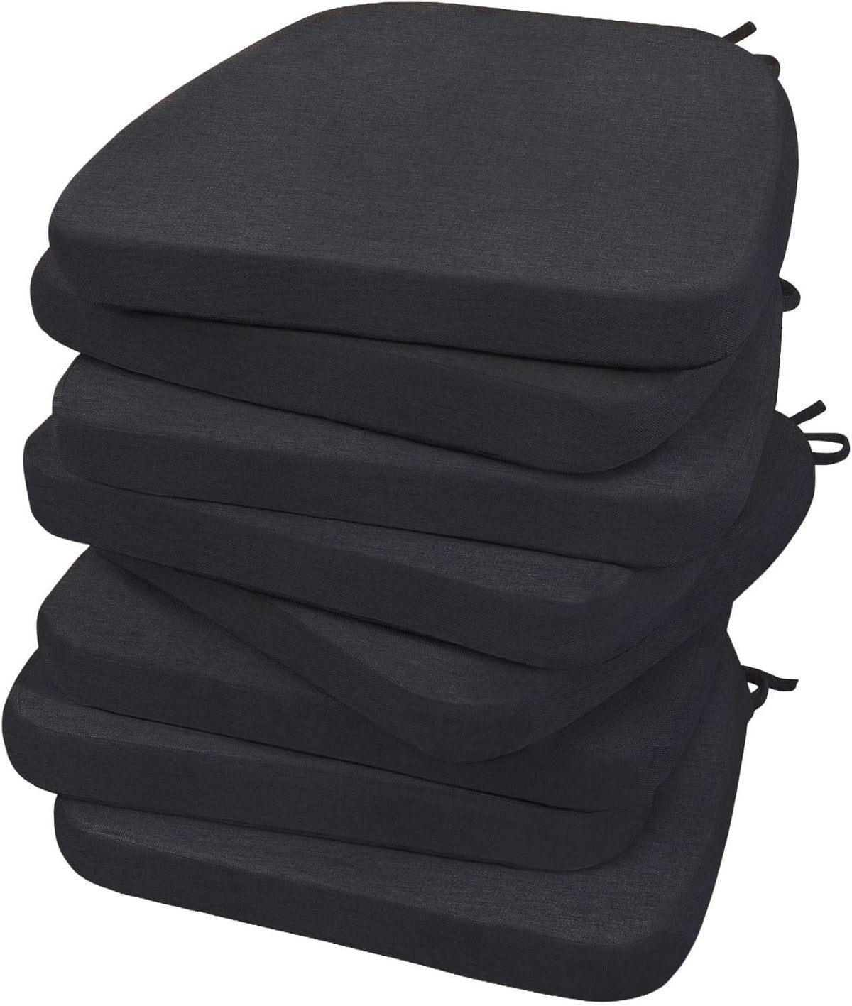 Tall staggered stack of six dark charcoal D-shaped chair cushions shown from a low angle, ties visible at the rear edges