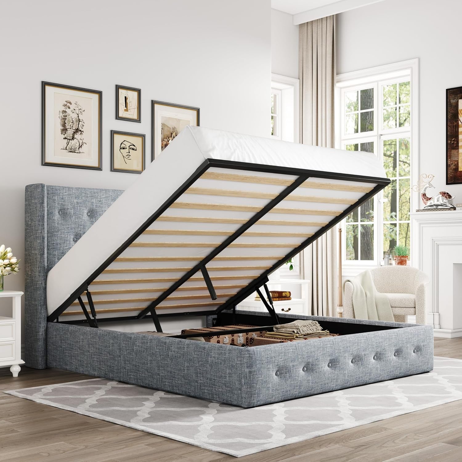 Blue-gray upholstered storage bed with gas-lift mattress raised showing interior storage