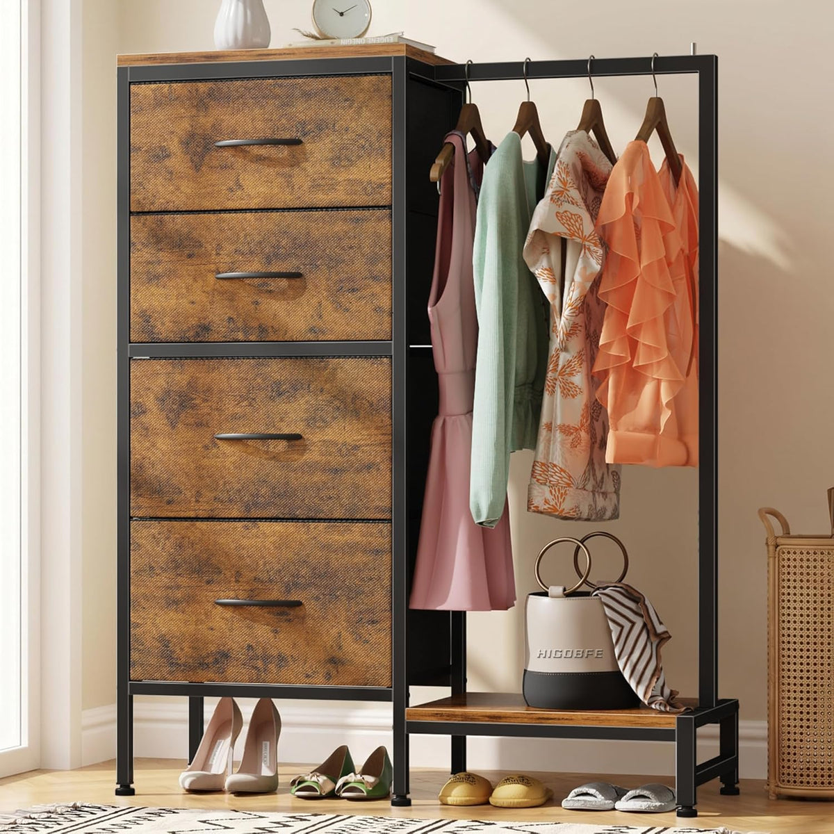 Close view of a wood-tone drawer column with black frame and clothes hanging beside it