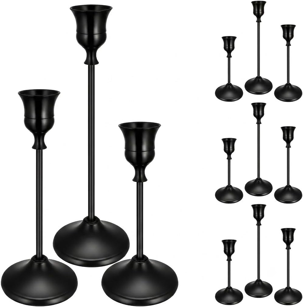 Three matte black metal taper candle holders with smaller black duplicates shown at right.