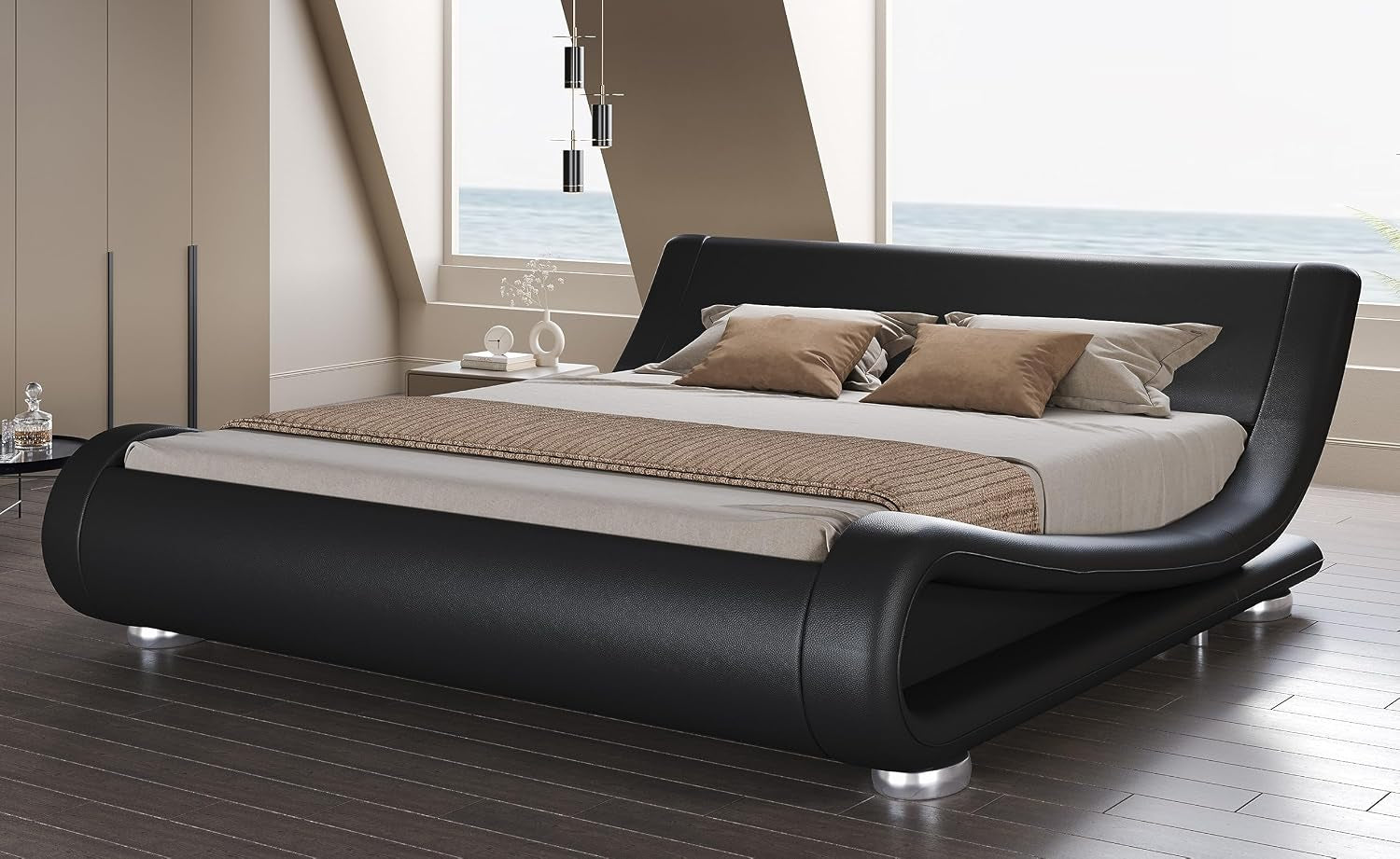 Angled front-right room shot of a black faux-leather wave platform bed with curved headboard and silver round legs.
