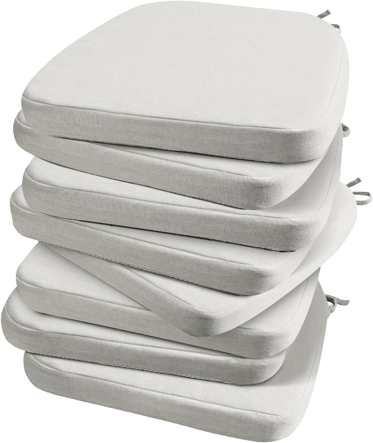 Angled close-up of a stack of light gray D-shaped chair pads, showing the rounded front and layered edges.