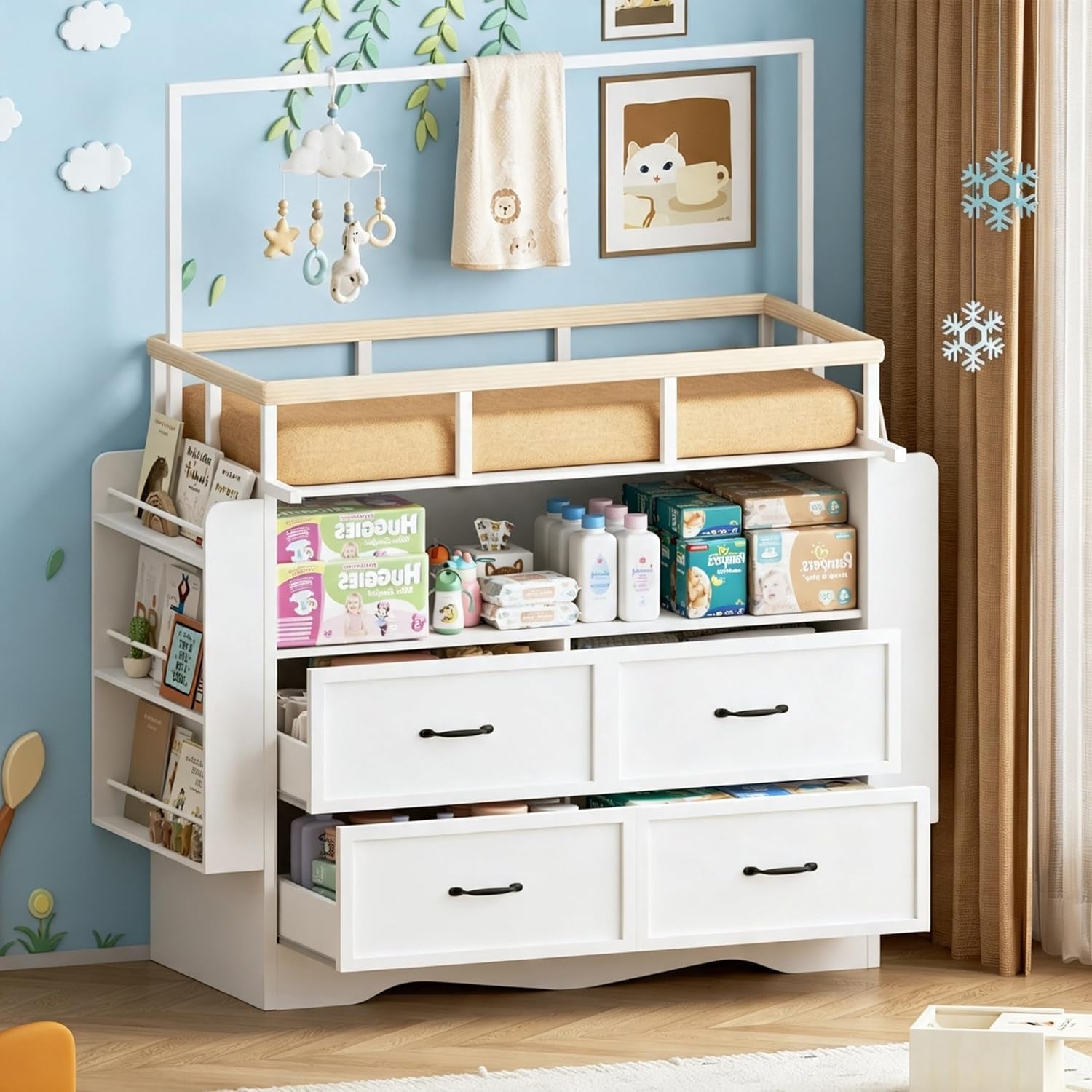 White changing dresser with a beige changing pad on top, open shelf stocked with diapers and bottles, and four white drawers
