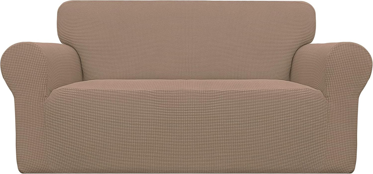 Front view of a loveseat-style armchair covered in a light brown/beige textured slipcover.