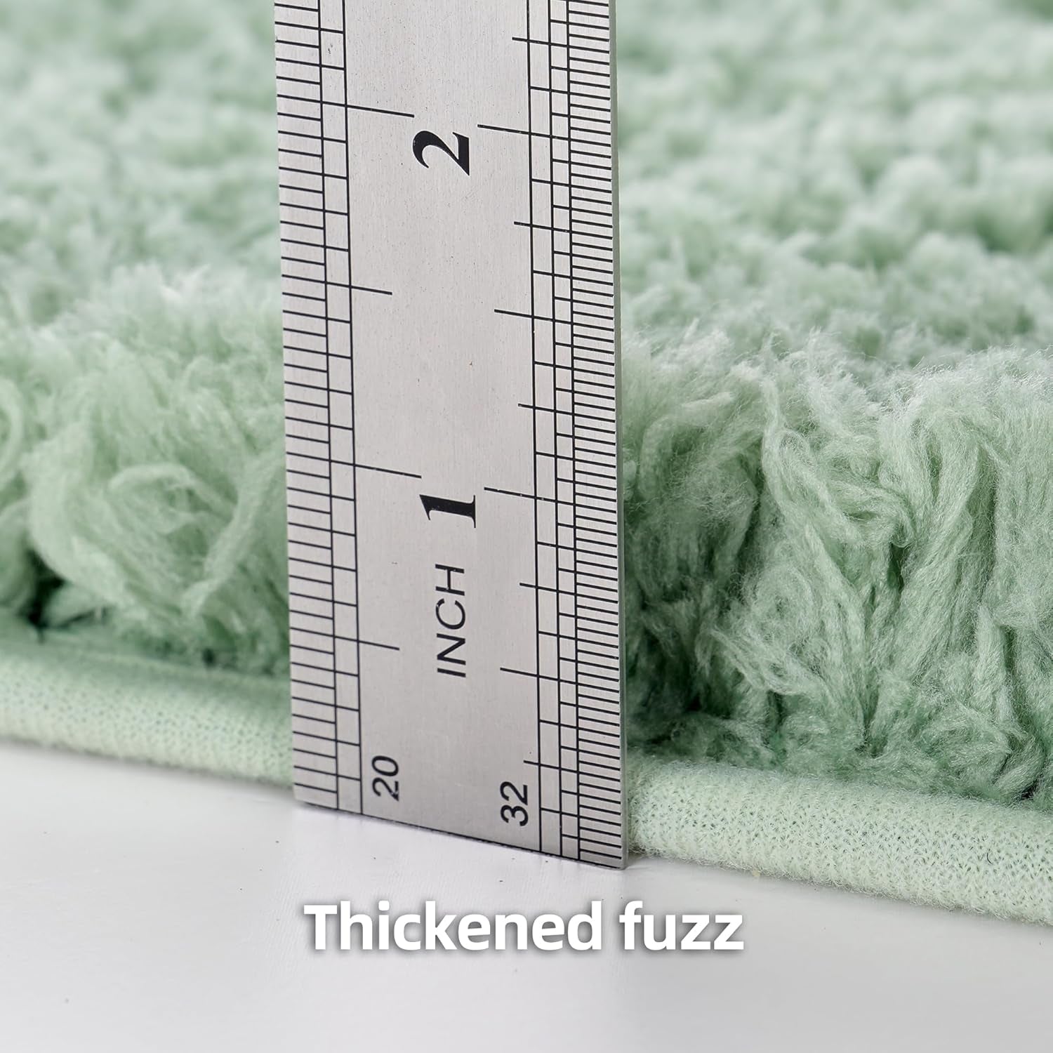 Close-up of rug edge and fluffy pile with a metal ruler standing beside the pile