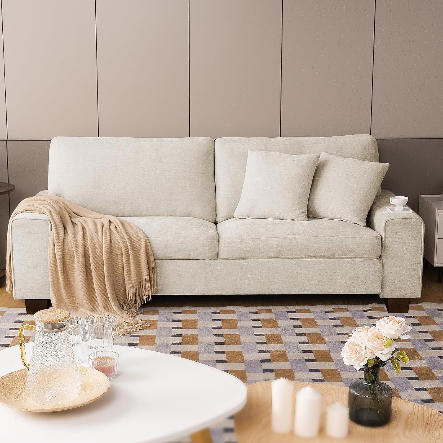 Light beige chenille 3-seat sofa front view staged with a throw blanket and coffee table