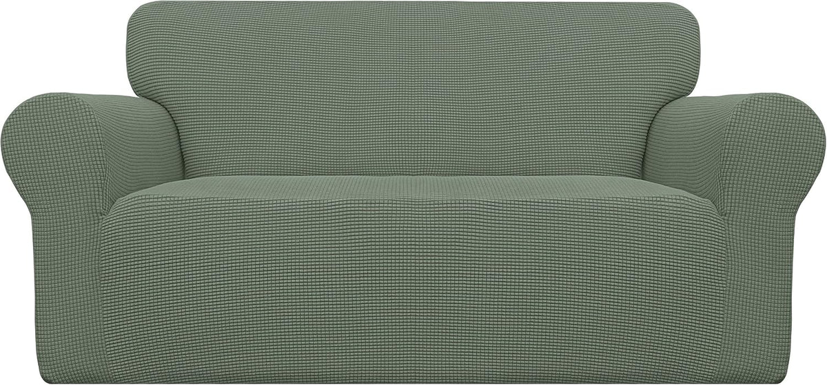 Front-facing loveseat with rolled arms shown in a sage green textured stretch slipcover.