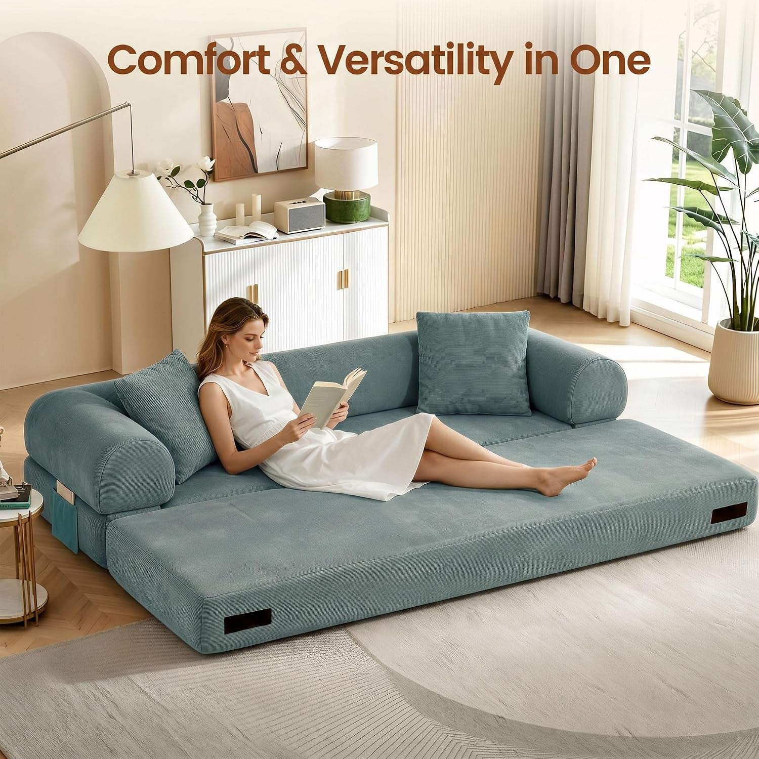 Low-angle view of the sofa set up as an expanded flat sleeping surface with woman reclining to show scale