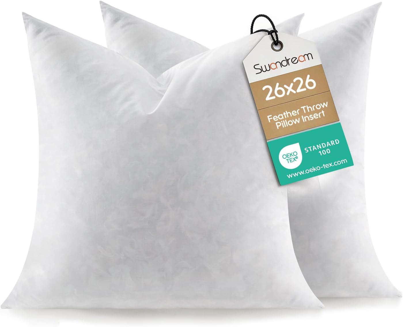 Pair of white throw pillows photographed slightly angled, corners pointed and soft shadows on a white surface.