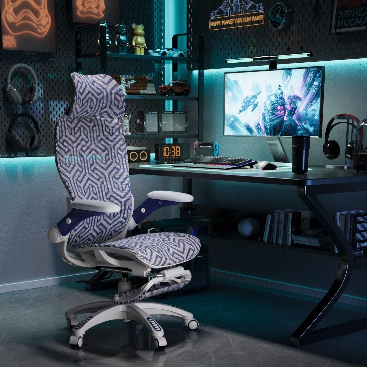 Patterned blue-and-white ergonomic chair with footrest beside a lit gaming desk and monitor.