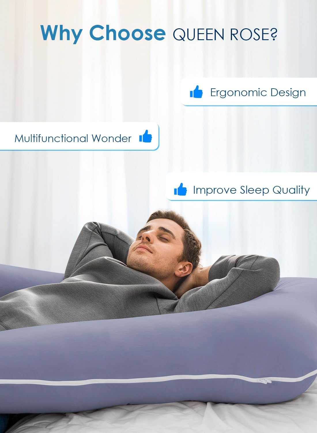 Man reclining with hands behind his head, resting inside the blue U-shaped body pillow on a bed.