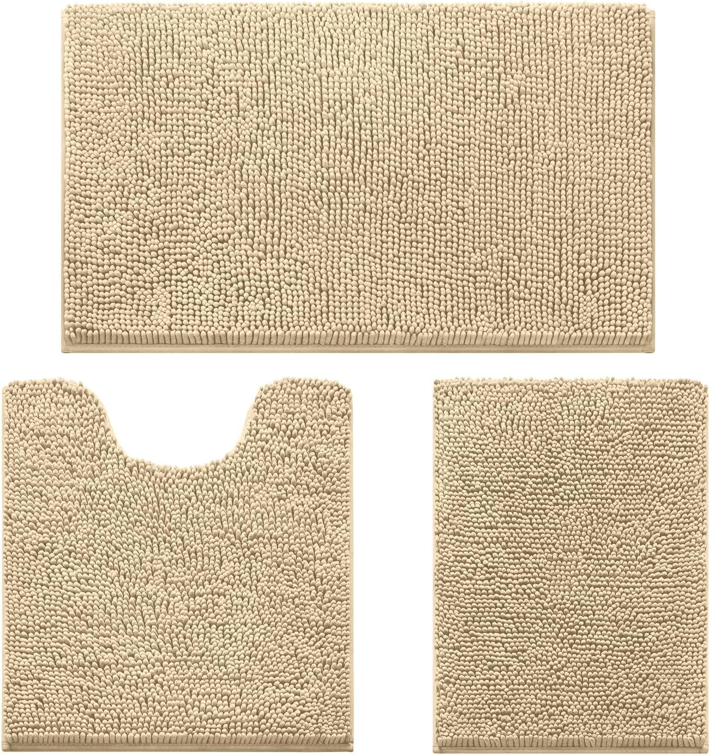 Flat lay of three tan chenille bath rugs: rectangular bath mat, U-shaped toilet rug, and small rectangular mat