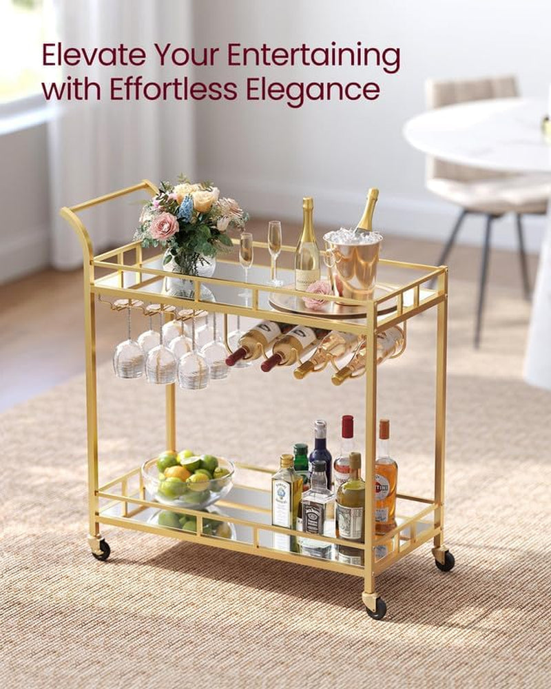 Bar cart on a woven rug with a floral arrangement on top and bottles on the lower mirrored shelf.
