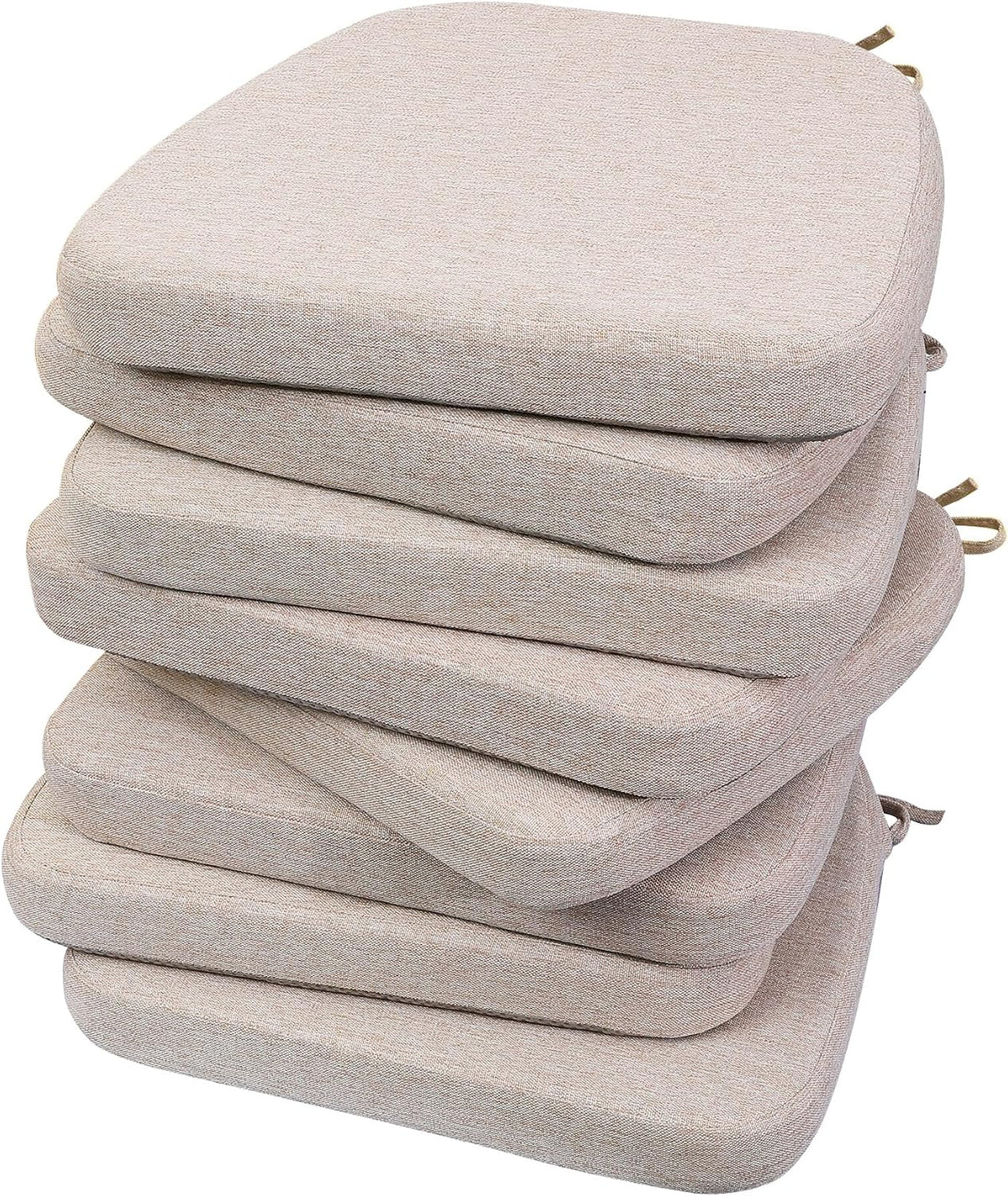 Stack of six D-shaped chair pads in a textured oatmeal beige fabric, shown from an angled close-up.