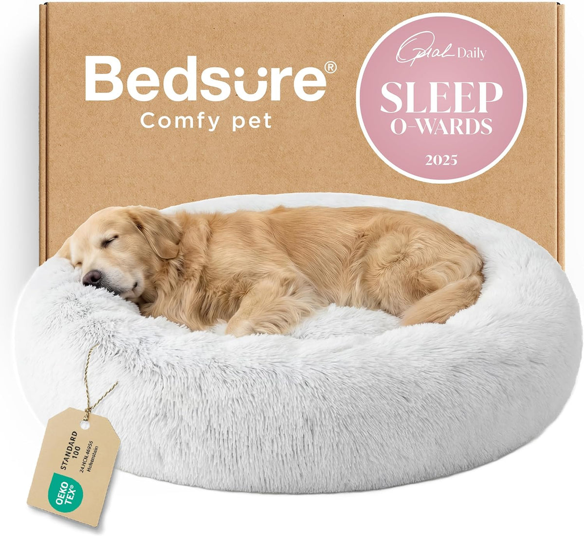 Sleeping golden dog curled in a white round faux-fur donut bed with a kraft box behind it.
