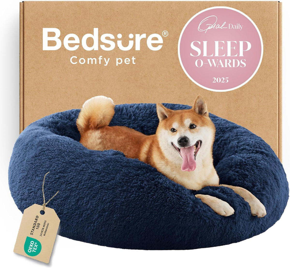 Three-quarter view of a navy blue faux-fur donut bed with a panting Shiba Inu resting and a product tag at the front.