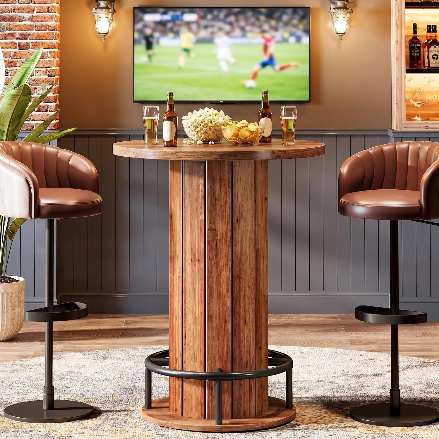 Round wood bistro table in a lighter natural finish with black metal foot ring, styled with two brown bar chairs