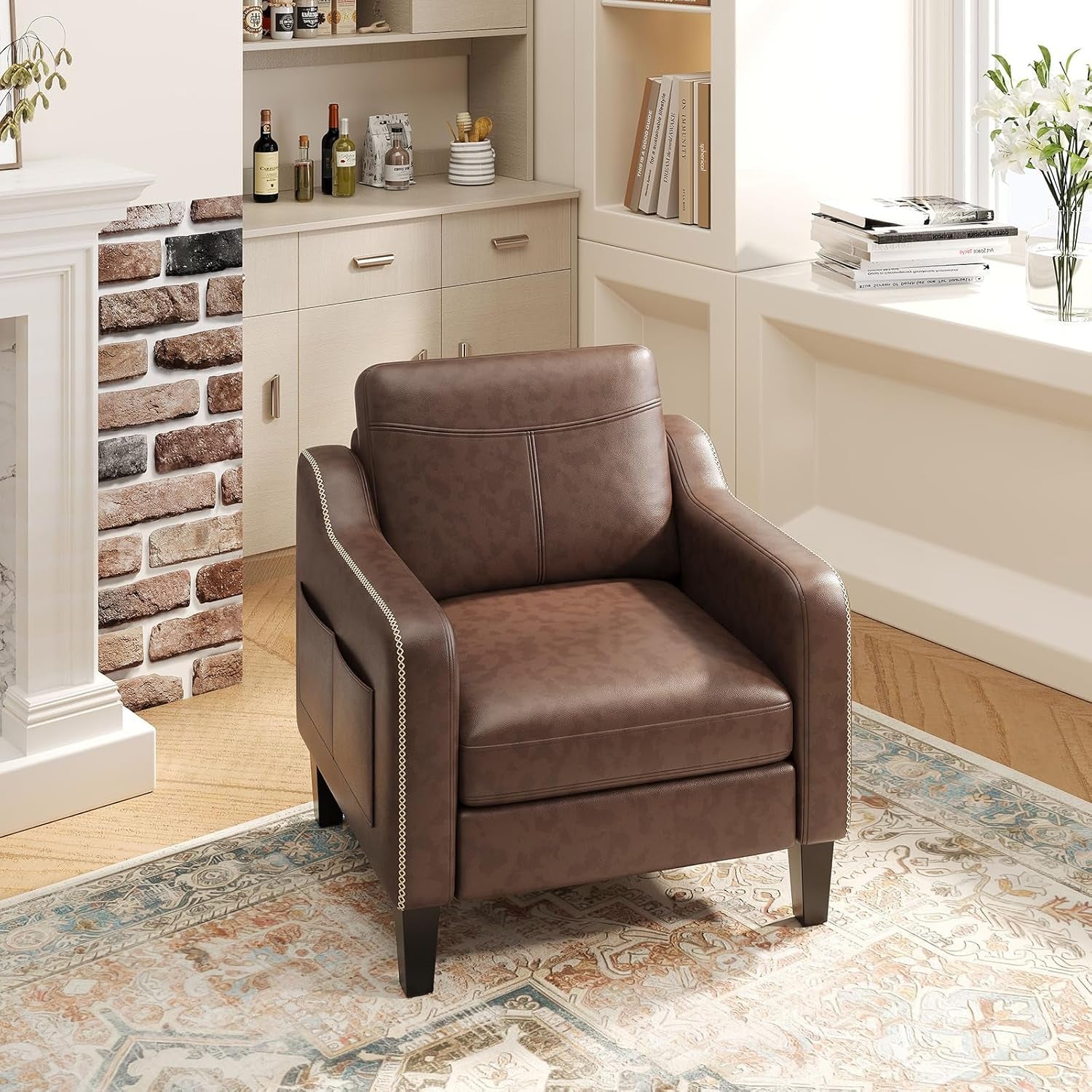 Single brown armchair with stitched arms and a side pocket next to a fireplace and window seat.