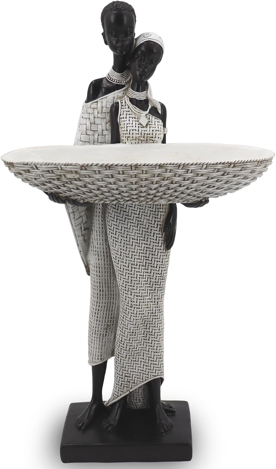Pair of standing black resin figures in white textured dresses holding a large oval woven tray