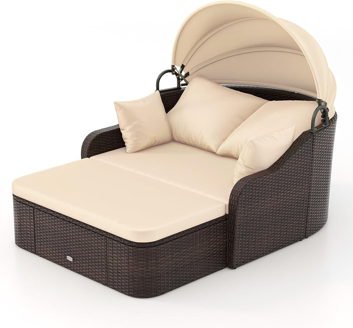 Three-quarter view of a mocha woven rattan daybed with beige cushions, pillows and a raised cream canopy.