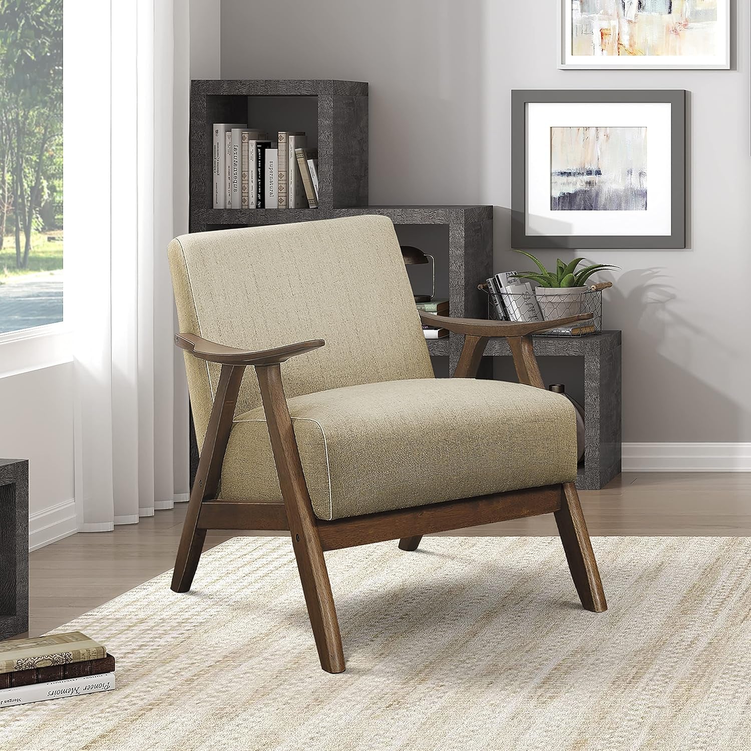 Single beige linen-look accent chair with walnut angled frame in a bright corner setting.