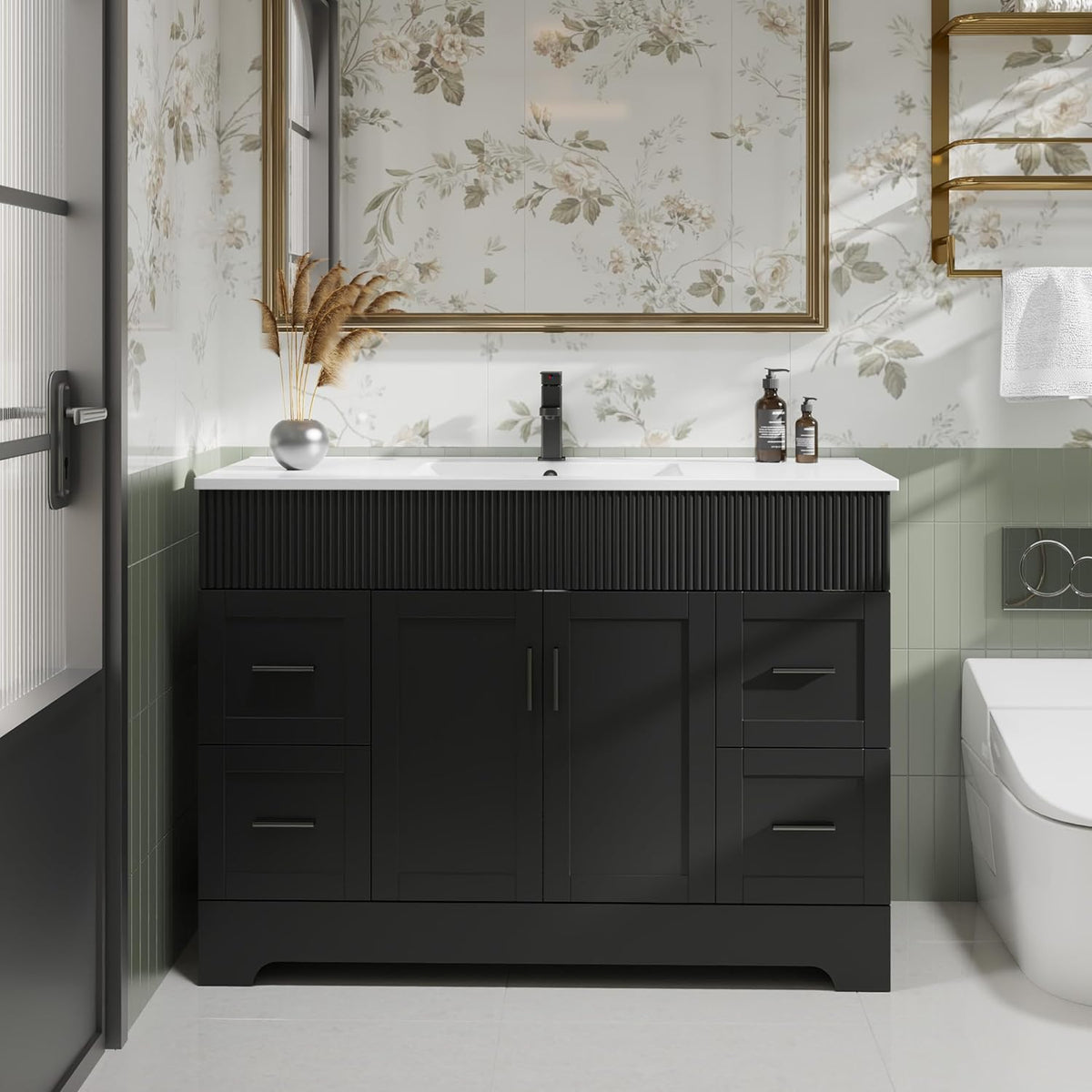 Front view of a black bathroom vanity with ribbed upper trim, white sink top and black faucet