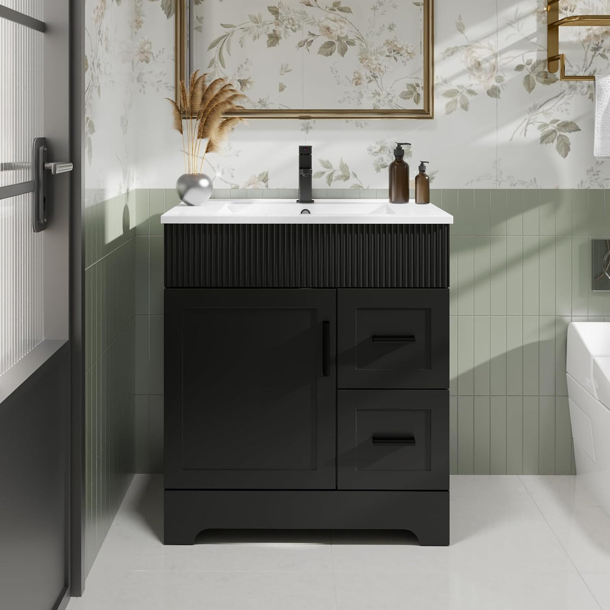 Close front view of a black single-sink vanity showing fluted top detail and drawer-door layout.