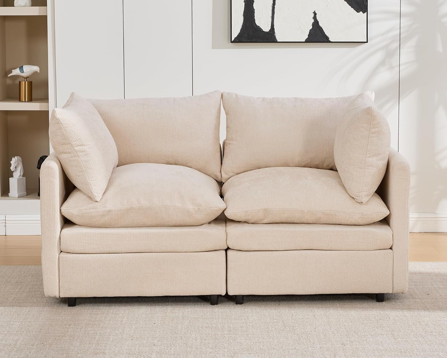 Front view of a cream two-seat modular loveseat with loose back and side cushions.