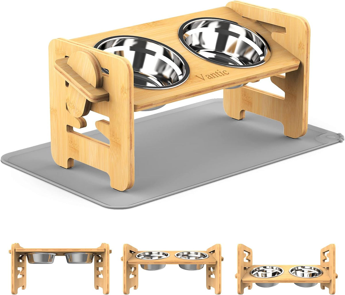 Light bamboo-colored adjustable feeder on a grey silicone mat showing two stainless bowls.