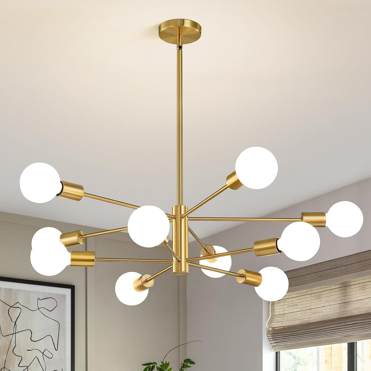 Gold sputnik chandelier with twelve illuminated globe bulbs centered in a softly lit room.