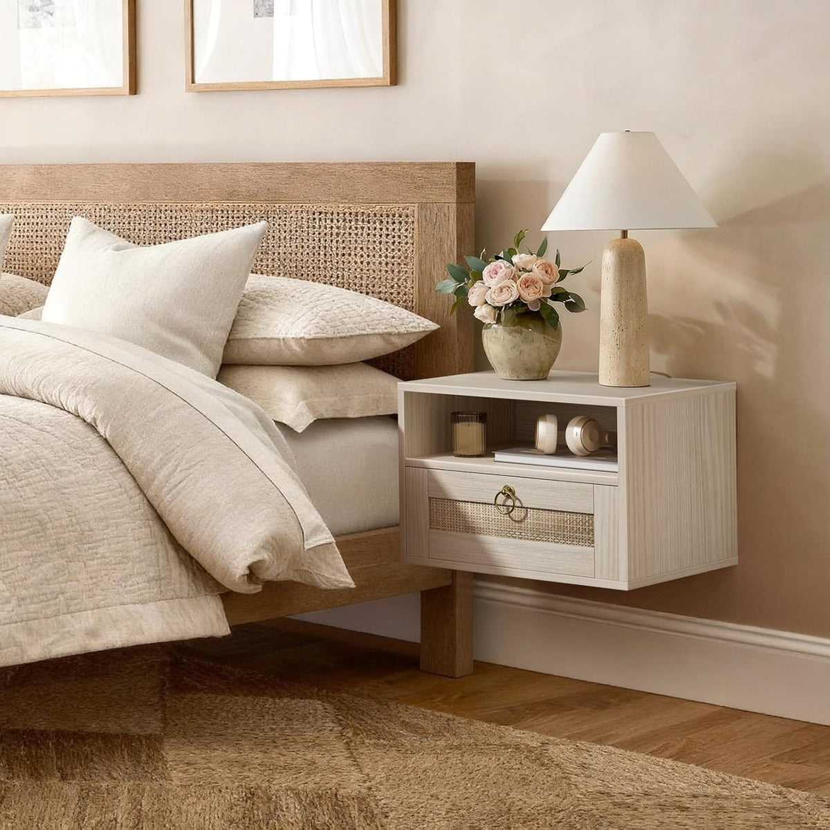 Styled bedroom scene with the light oak floating nightstand wall-mounted beside a bed with a lamp and vase