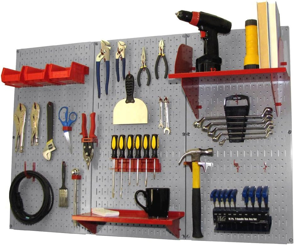Three gray pegboard panels with red shelves and bins holding tools, a hammer and a mug on a shelf.