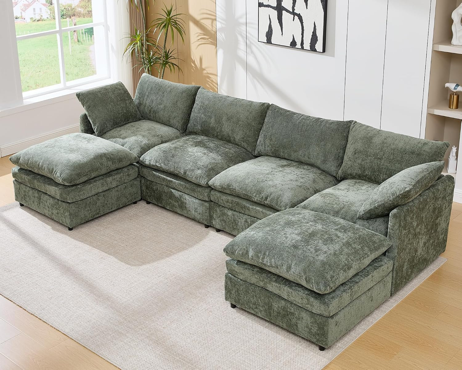 Green four-seat modular sectional in a U-shape with two ottomans.