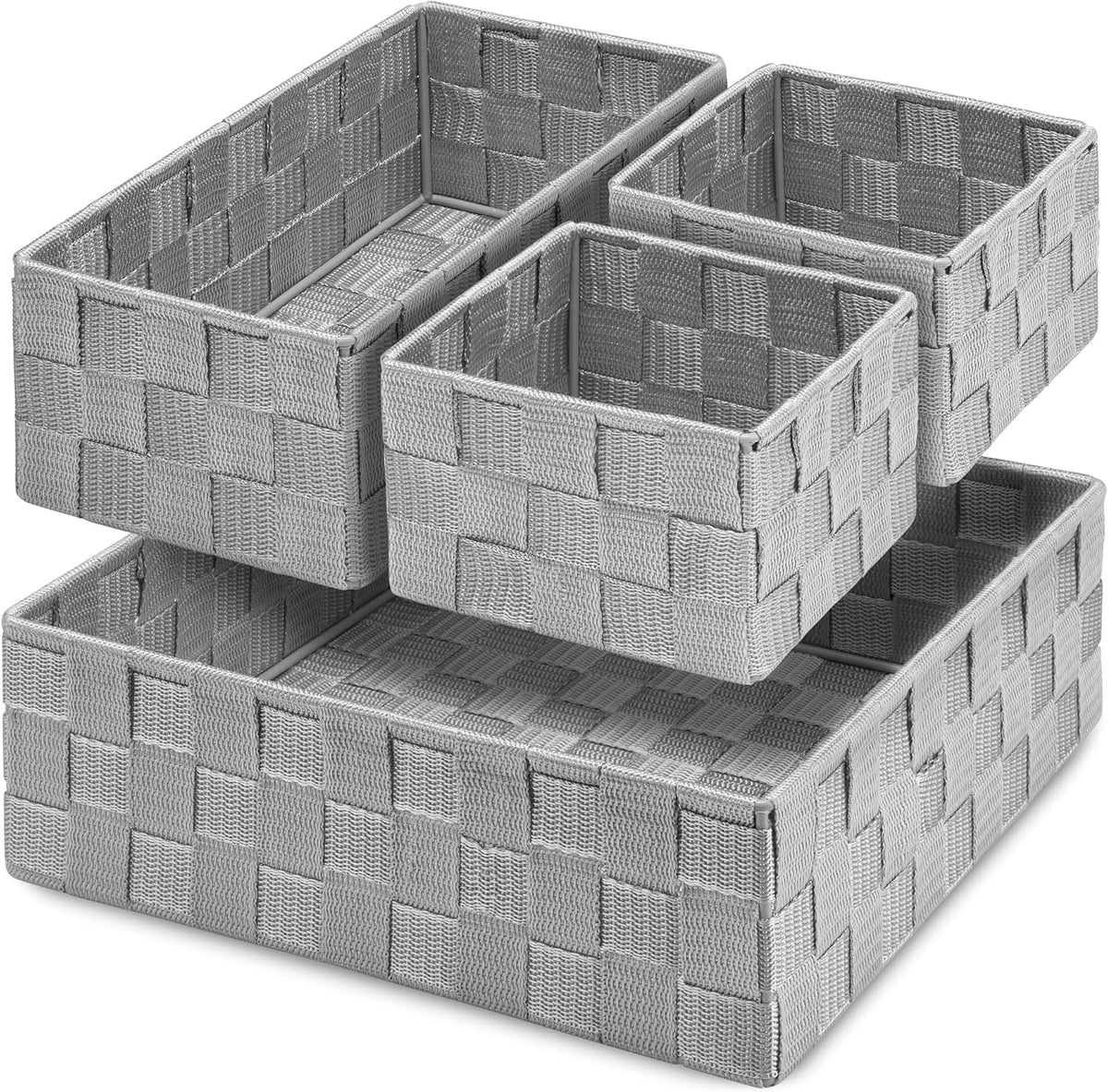 Angled studio shot of four woven storage baskets stacked in a staggered layout, shown in light gray.