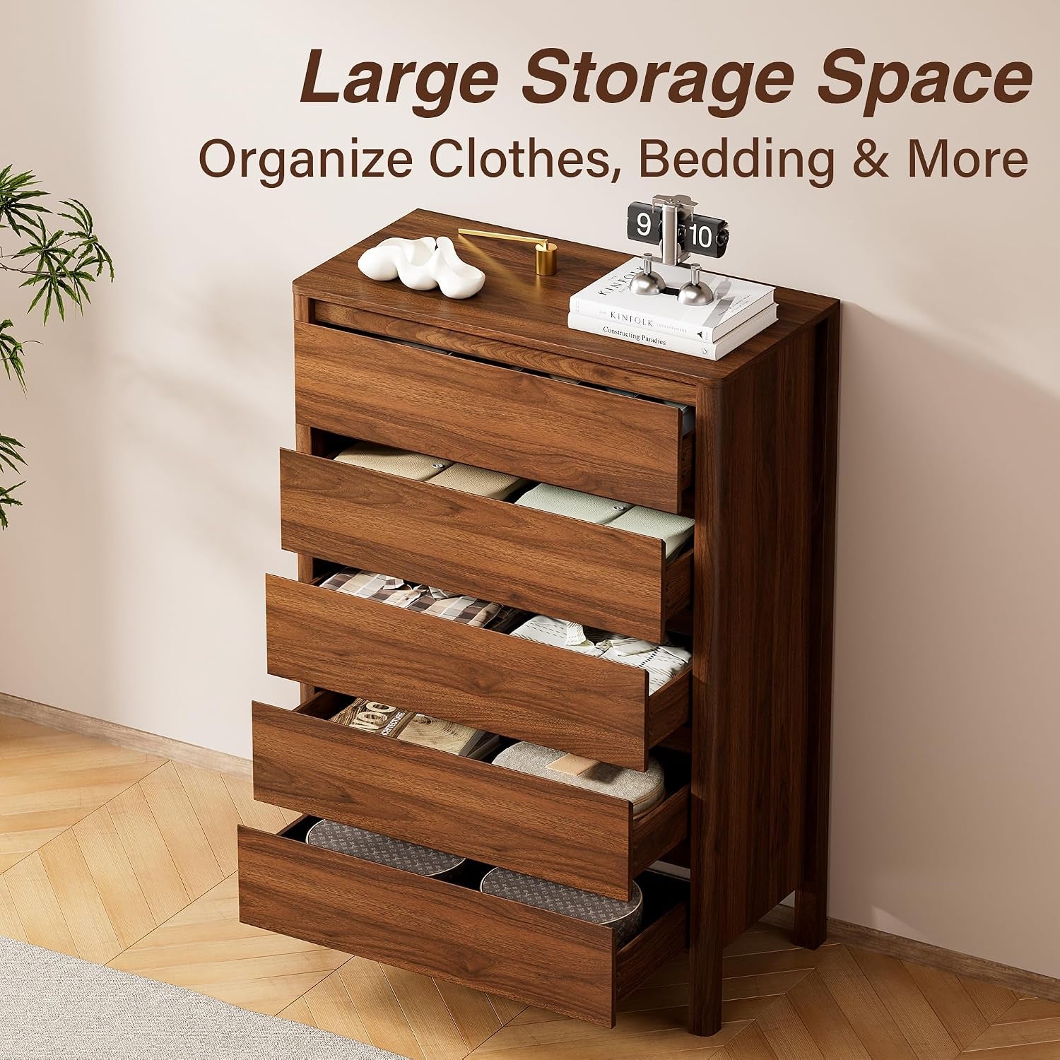 Angled view of the dresser with multiple drawers open displaying organized clothing and large storage space