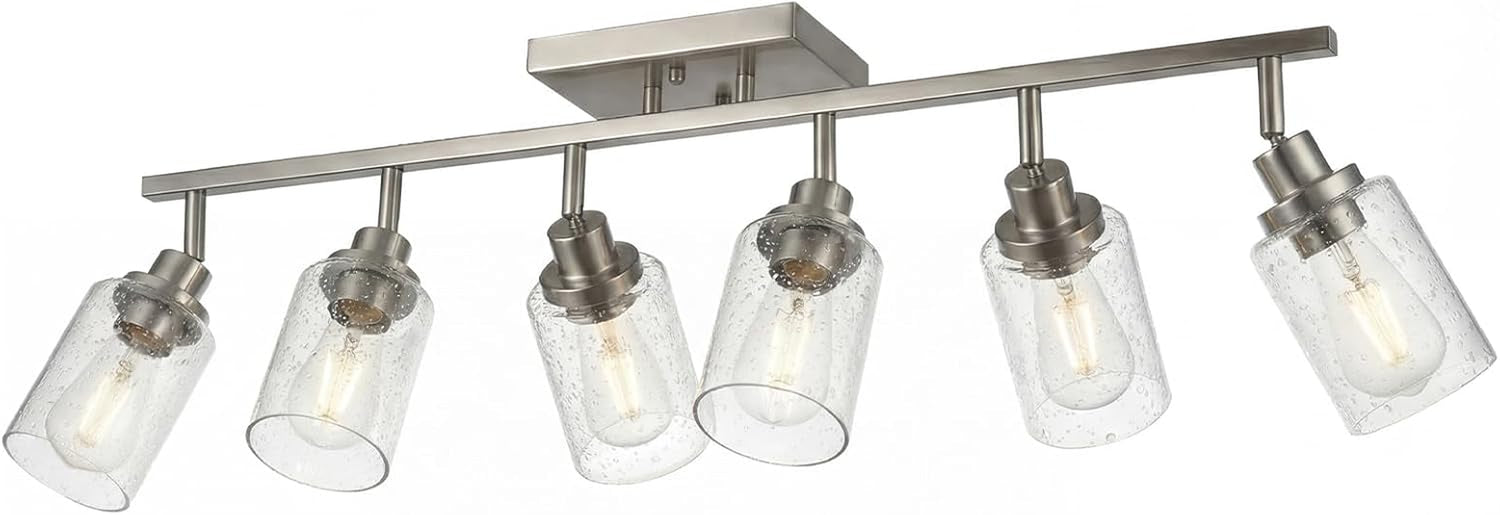 Studio photo of the five-light track in a brushed nickel finish with six seeded glass cylinder shades on a white background.