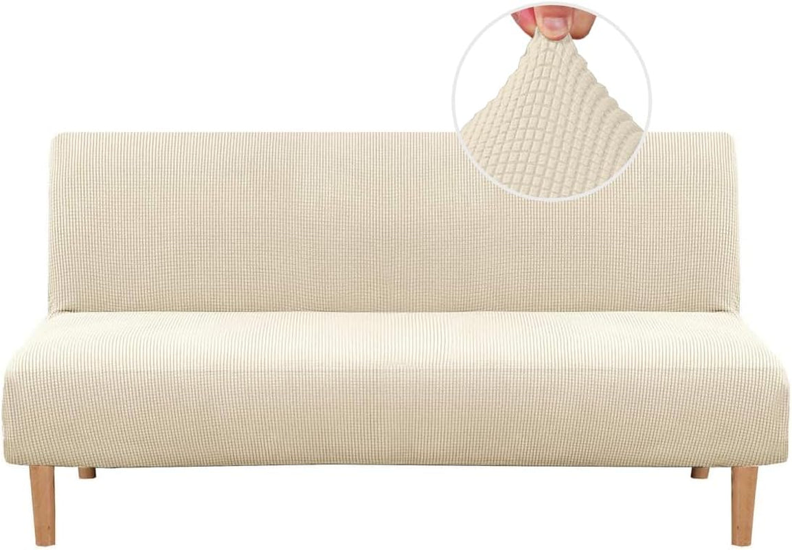 Front view of a cream small-check textured slipcover stretched over a futon with wood legs