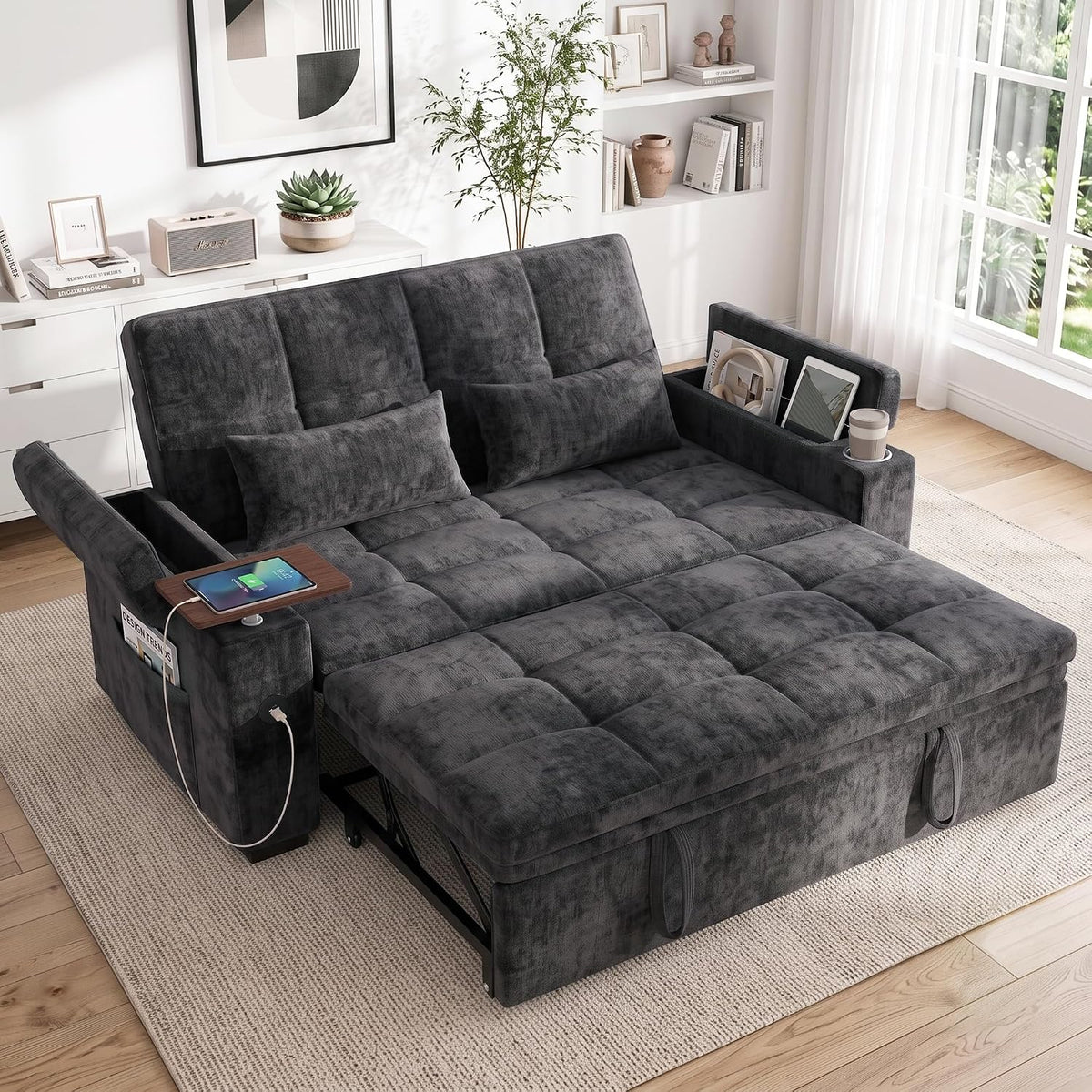Dark grey chenille sleeper sofa bed pulled out, angled front view with swivel tray and visible USB cable