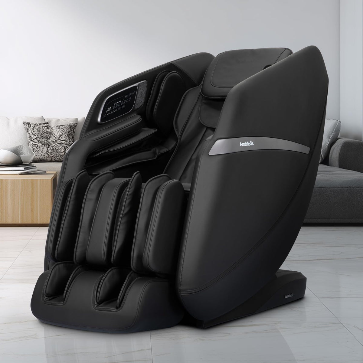 Black full-body massage chair angled slightly left in a bright living room beside a sofa and wooden side table.