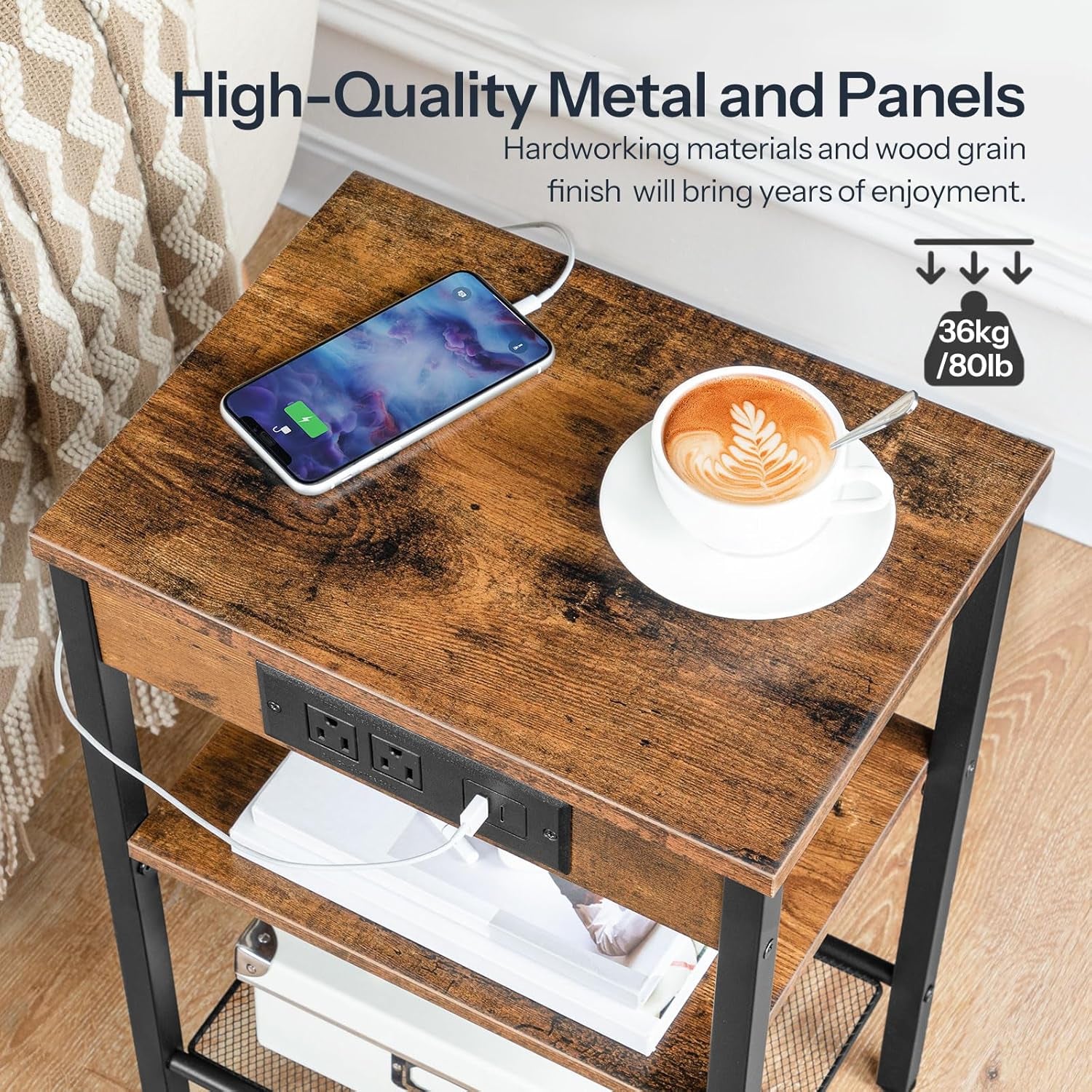 Close-up of a wood-grain side table top with a phone charging, cup, and built-in outlet panel beneath the top