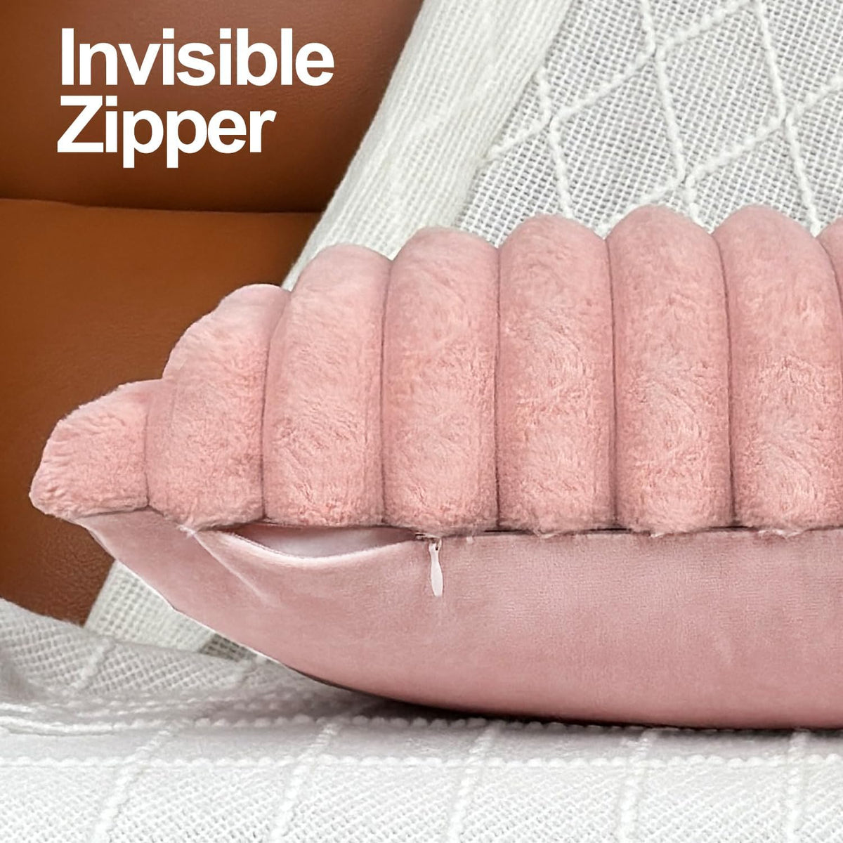 Close view of pink ribbed pillow edge showing a small hidden zipper
