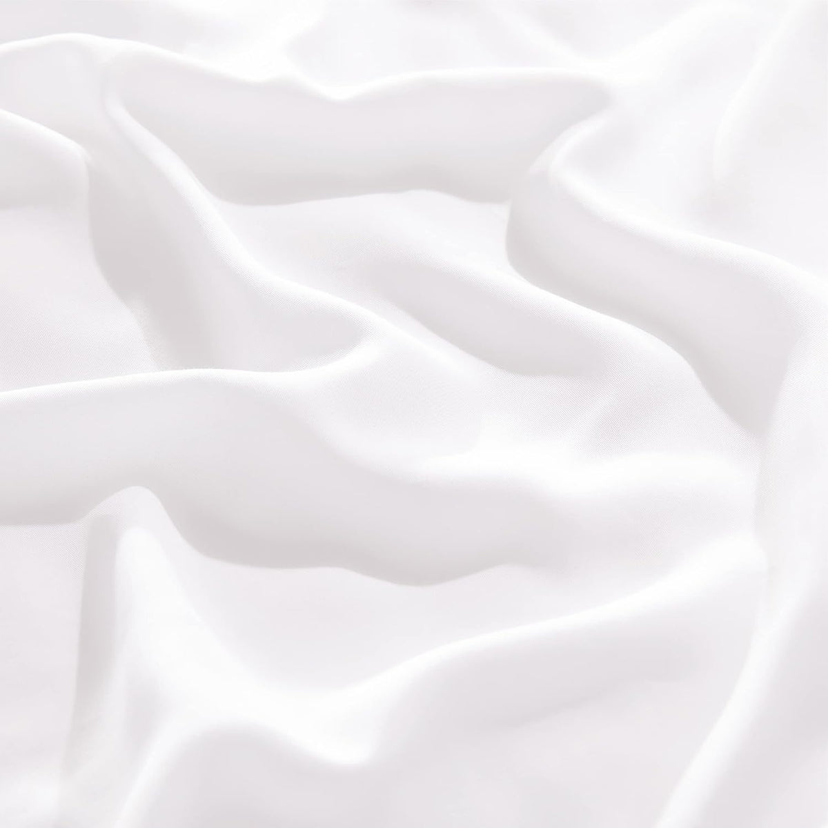 Close-up of smooth white sheet fabric with soft folds and subtle sheen