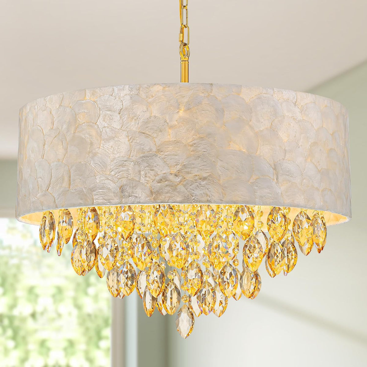 Wider detail of the scalloped capiz-style shade rim with clustered hanging crystals and gold chain.