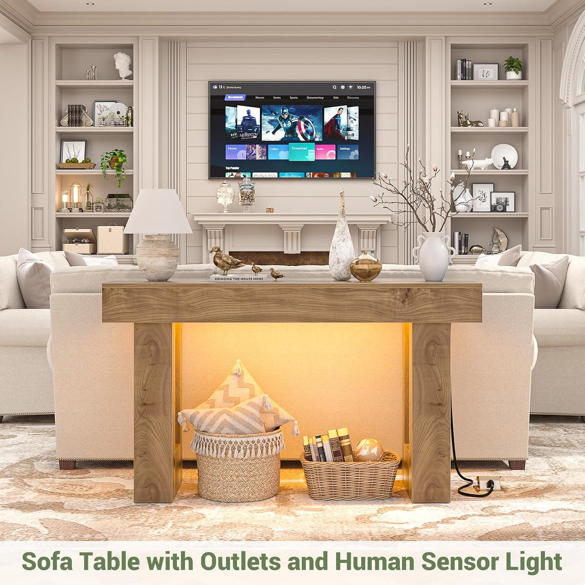 Front-facing view of console table lit from beneath with baskets and decor arranged under the tabletop in a living area