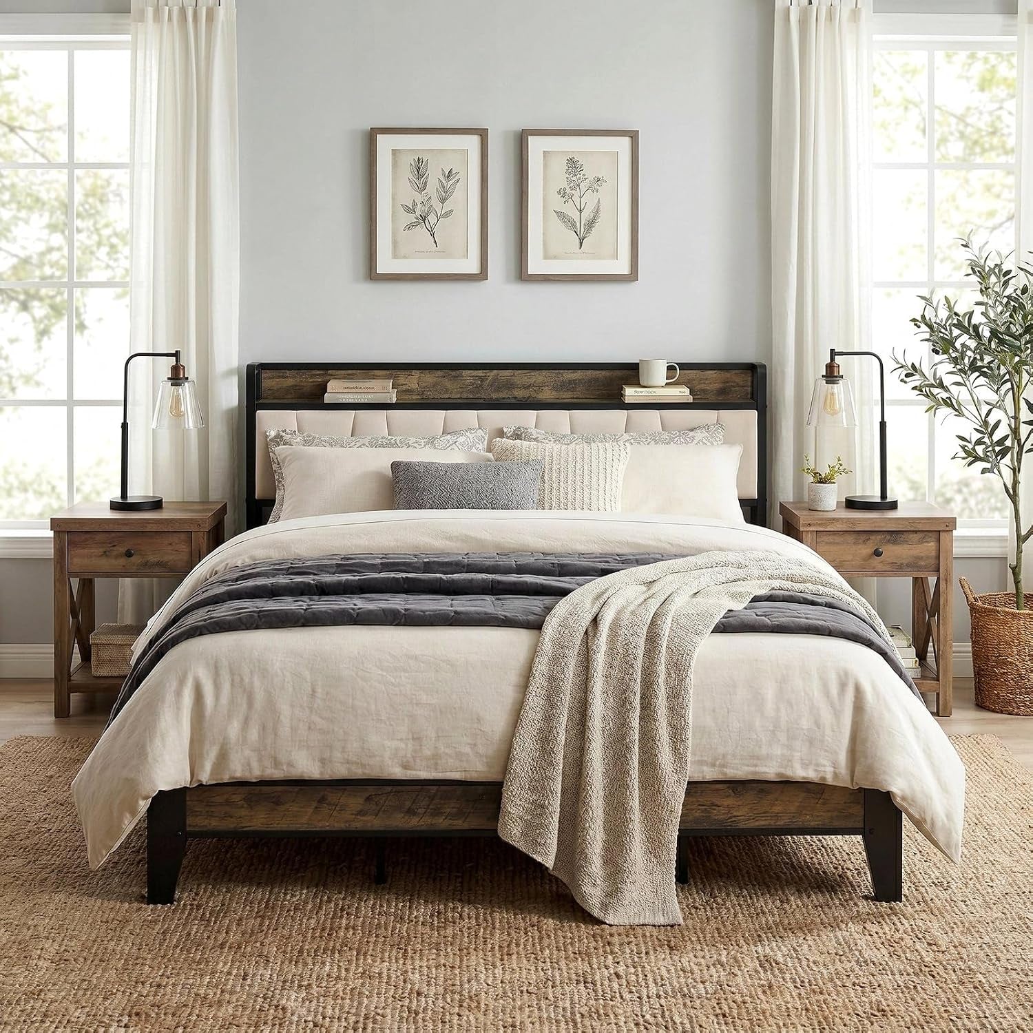 Centered view of a bed with a wood-toned headboard, black frame, layered pillows and matching nightstands.