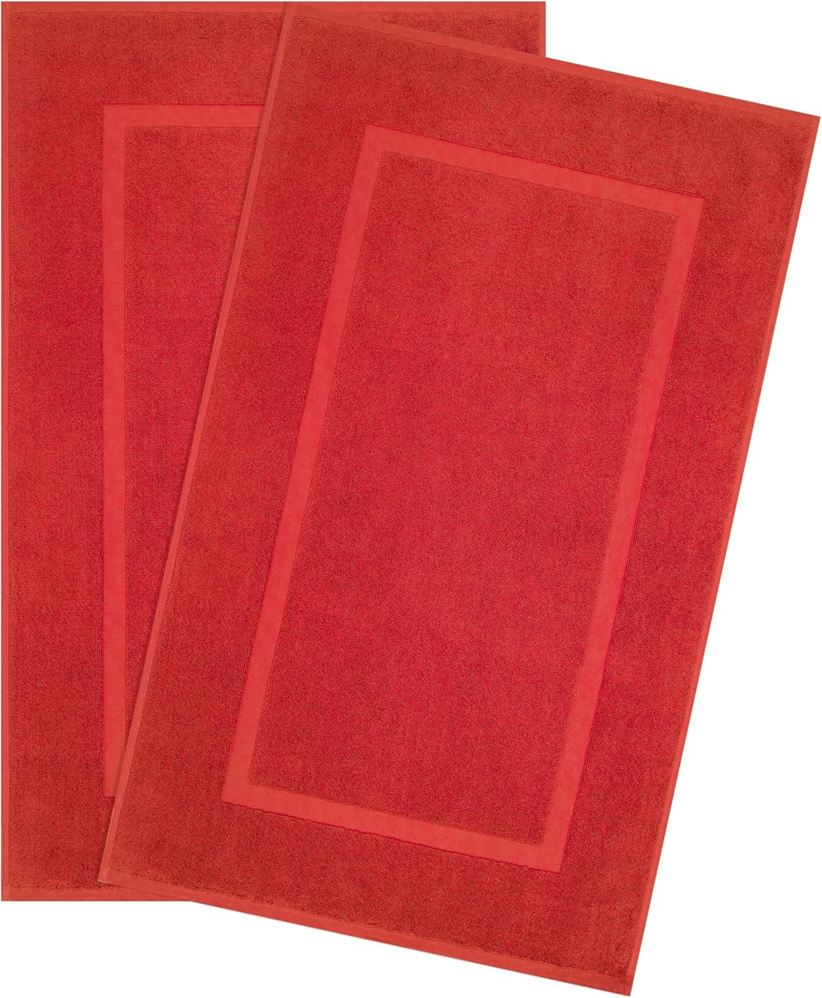 Two rectangular red bath mats overlapped, showing a bordered inset design and terry texture.