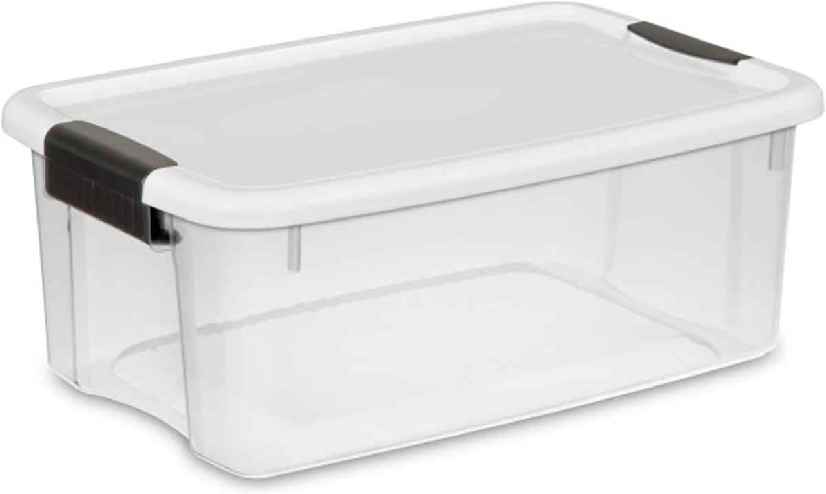 Angled view of an empty clear storage container with a white snap-on lid and black latch