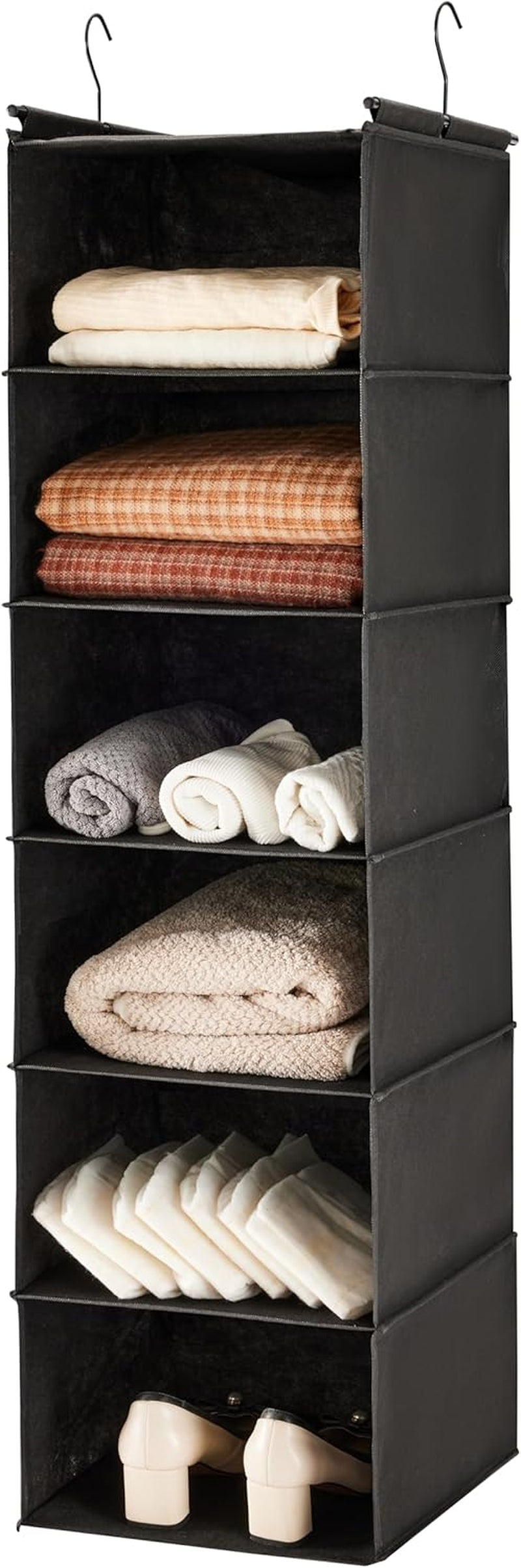 Front view of a six-tier grey hanging closet organizer with two metal hooks, holding folded clothes and a pair of shoes.